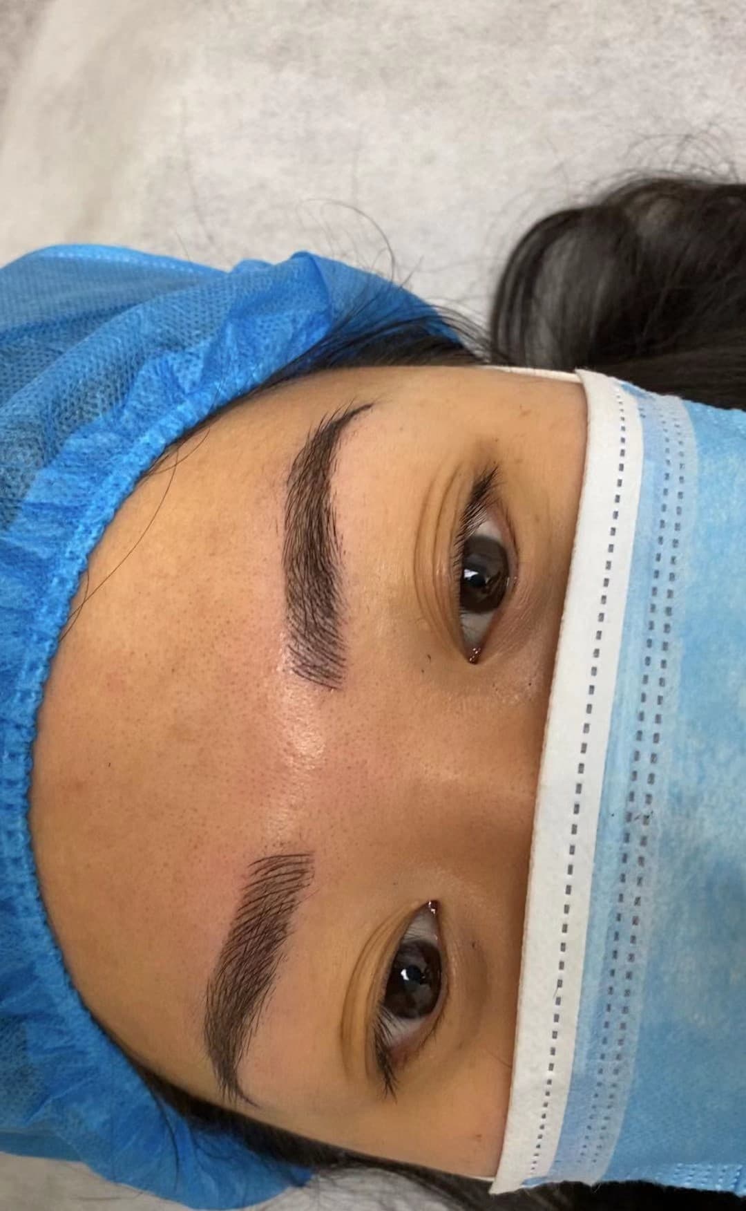 Client with balanced, natural-looking hair-stroke eyebrows